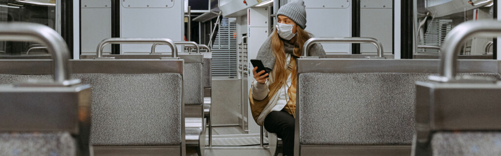 Woman wearing mask on a train