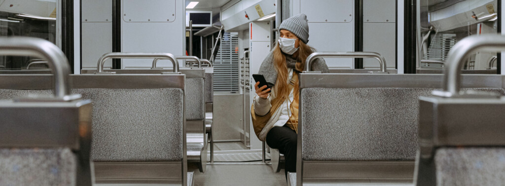 Woman wearing mask on a train