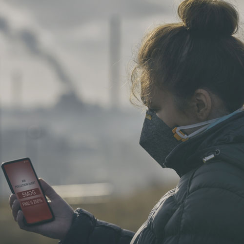 Woman looking at an air detection app